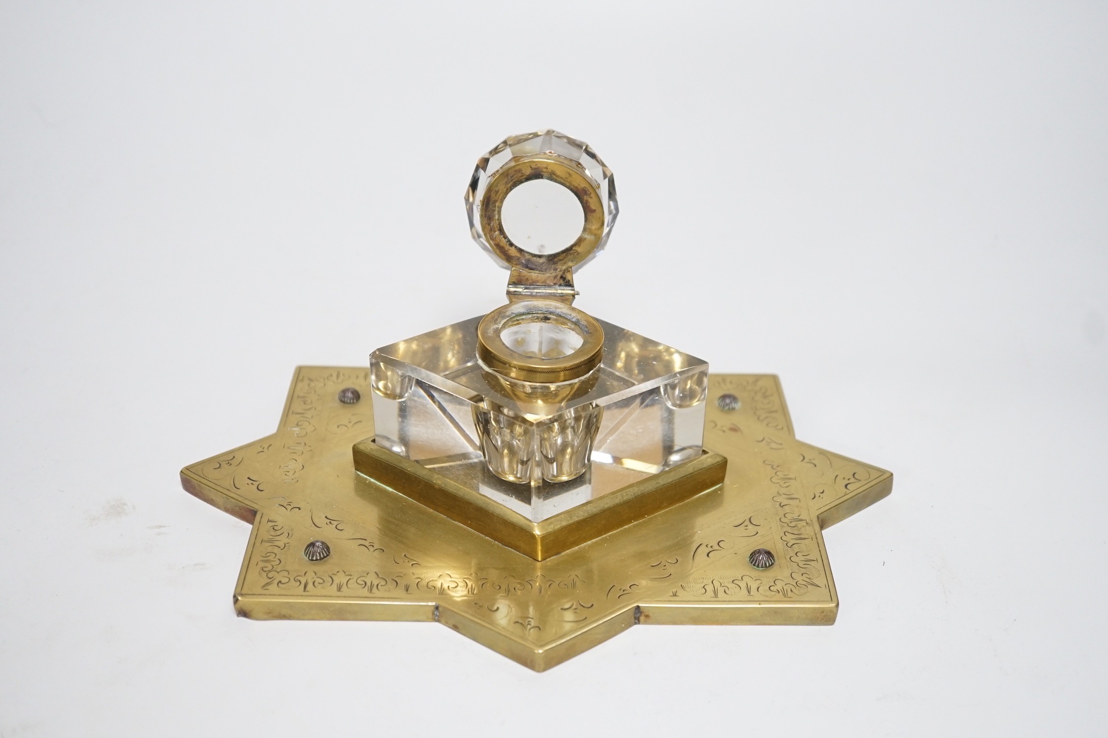 A Victorian brass mounted glass inkwell. 24cm wide